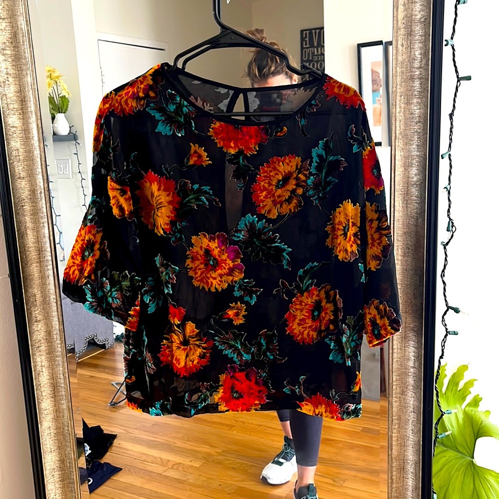 Really cute sheer top with floral print. Had forever, never worn.